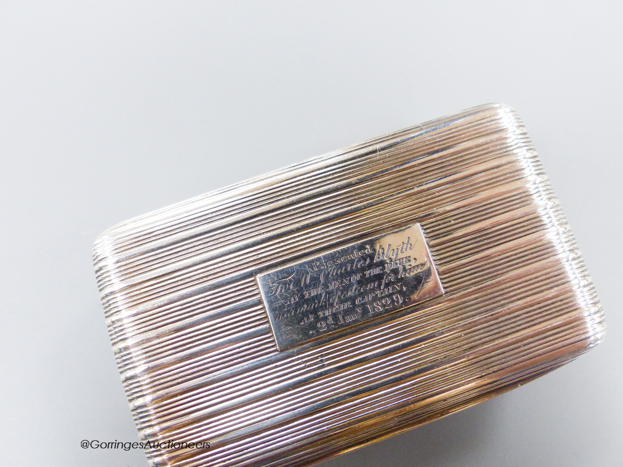 A George IV ribbed silver rectangular snuff box, with engraved inscription, Thomas Shaw, Birmingham, 1824, 71mm, 74 grams.